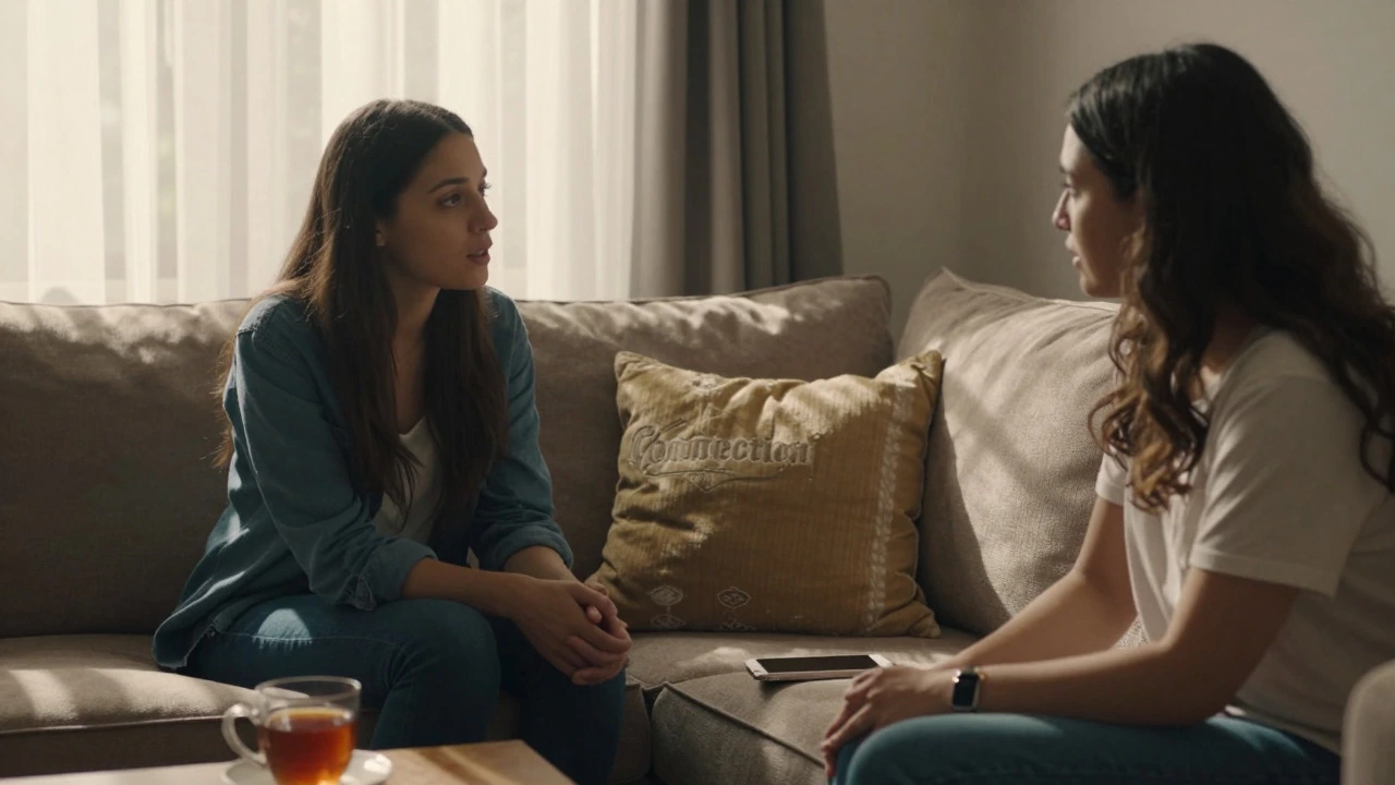 Two friends having a heartfelt conversation on a sofa in a sunlit room